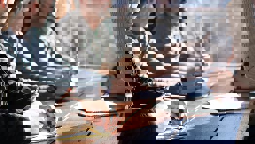 group of workers sitting around a table