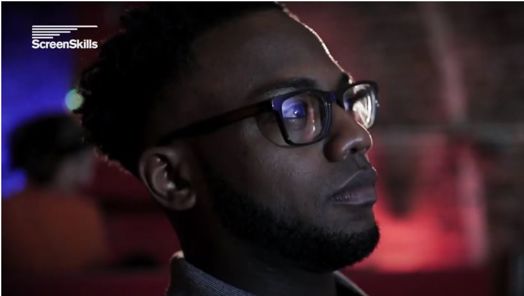 A close up of a man looking at something towards the right