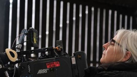 Mary Farbrother operating a camera