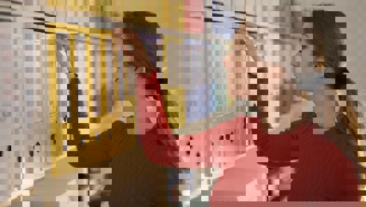 assistant grabs a folder from a shelf