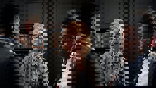 colleagues in suit talking to each other