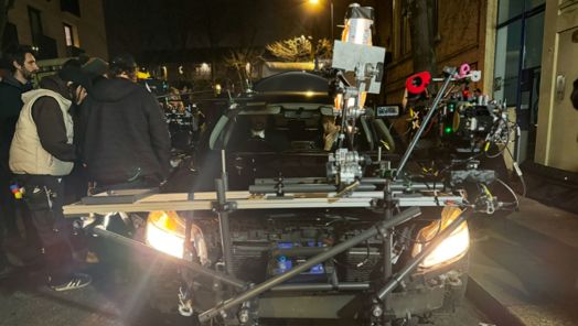 A team installing a car grip on a film shoot