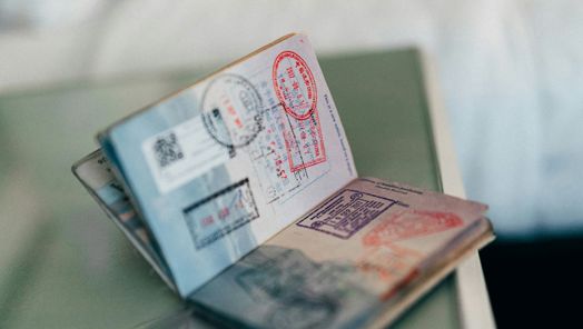 Close up generic image of a passport open with stamps on the pages